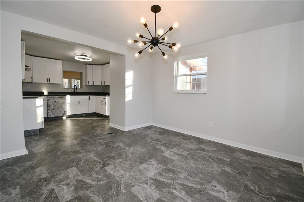 217 Oaklyn Road Bethel Park, PA 15102 - Photo 9 of 42 a view of a kitchen with a sink stainless steel appliances and cabinets