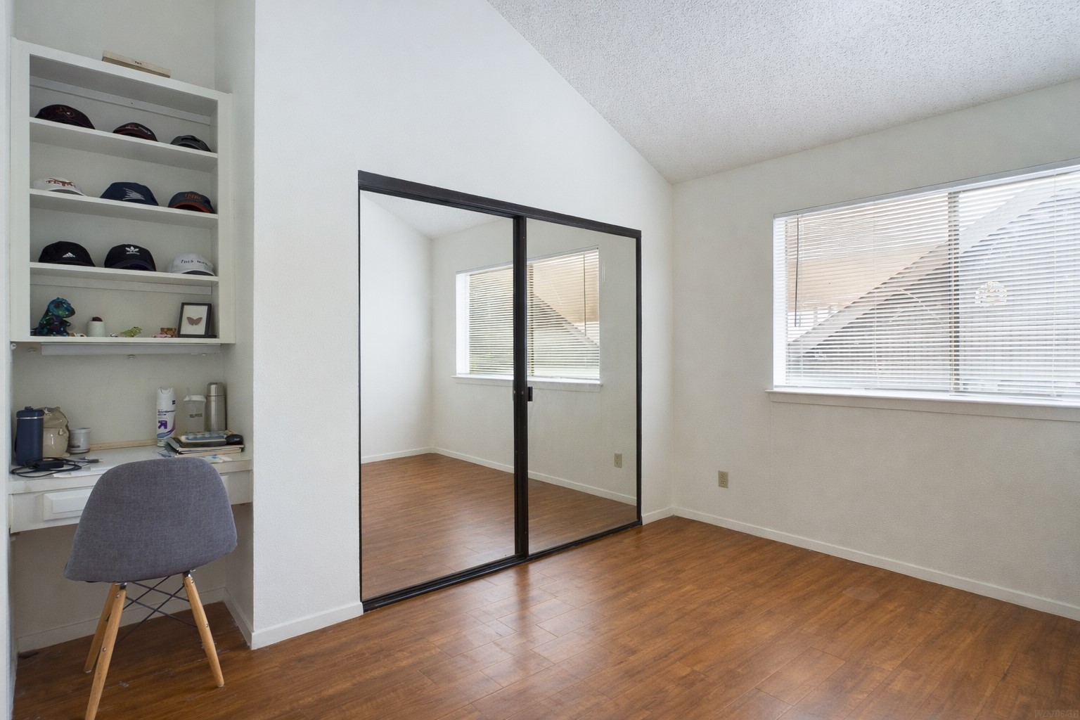 908 Poplar Street, Unit 201 Austin, TX 78705 - Photo 11 of 18 a view of a workspace with furniture and a window