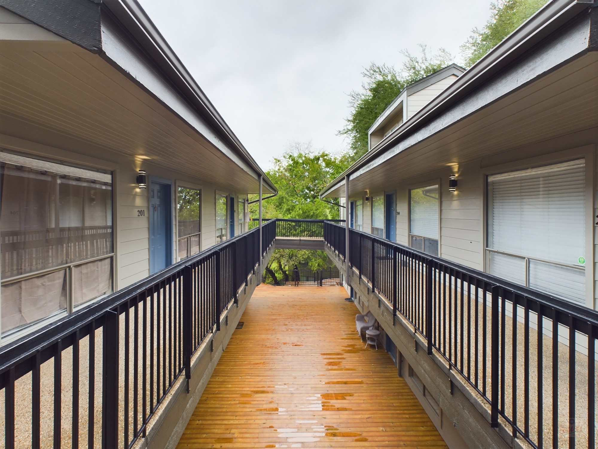908 Poplar Street, Unit 201 Austin, TX 78705 - Photo 12 of 18 a view of a balcony with wooden stairs