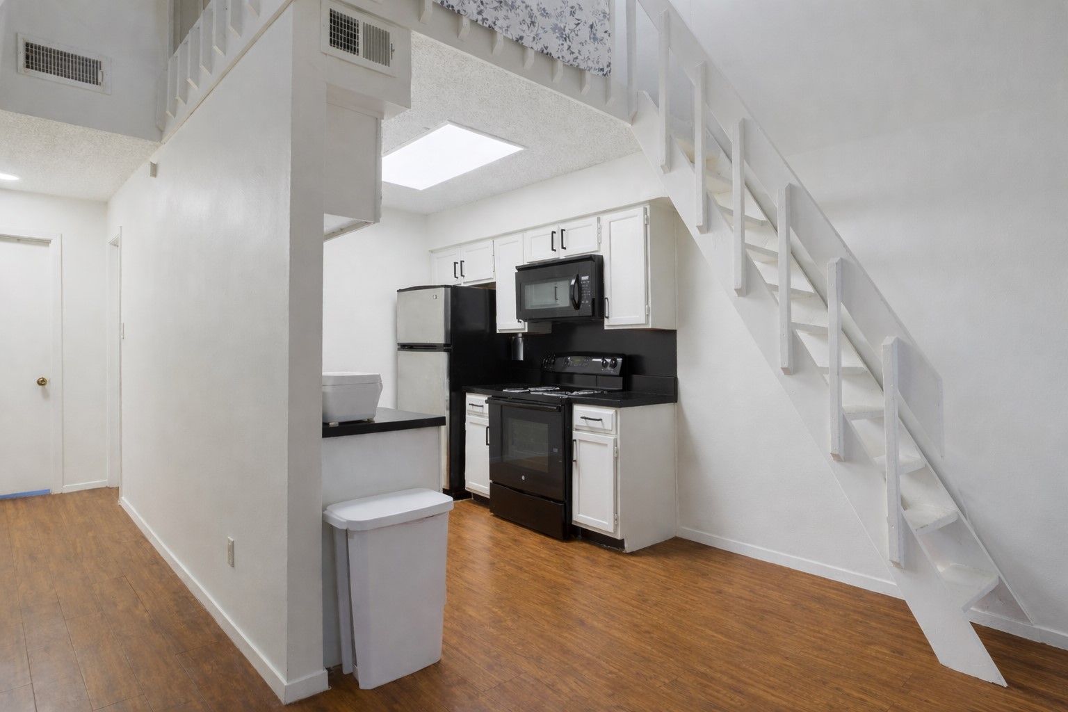 908 Poplar Street, Unit 201 Austin, TX 78705 - Photo 3 of 18 a view of kitchen with sink and refrigerator