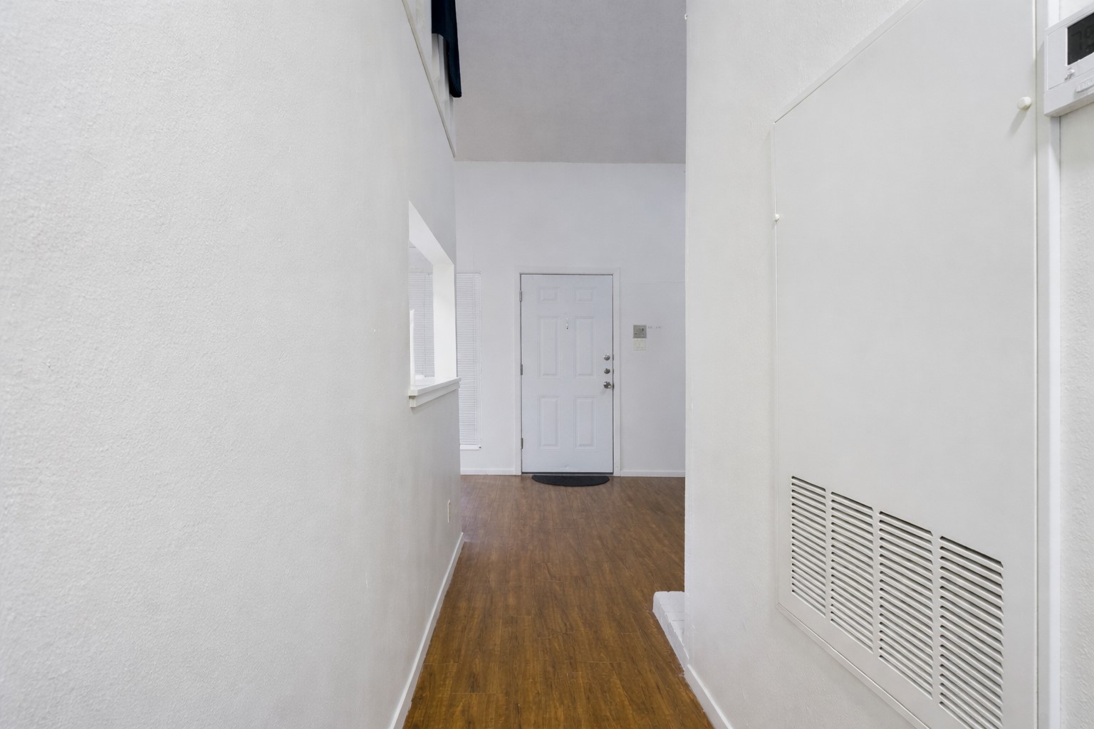 908 Poplar Street, Unit 201 Austin, TX 78705 - Photo 4 of 18 a view of a hallway with wooden floor