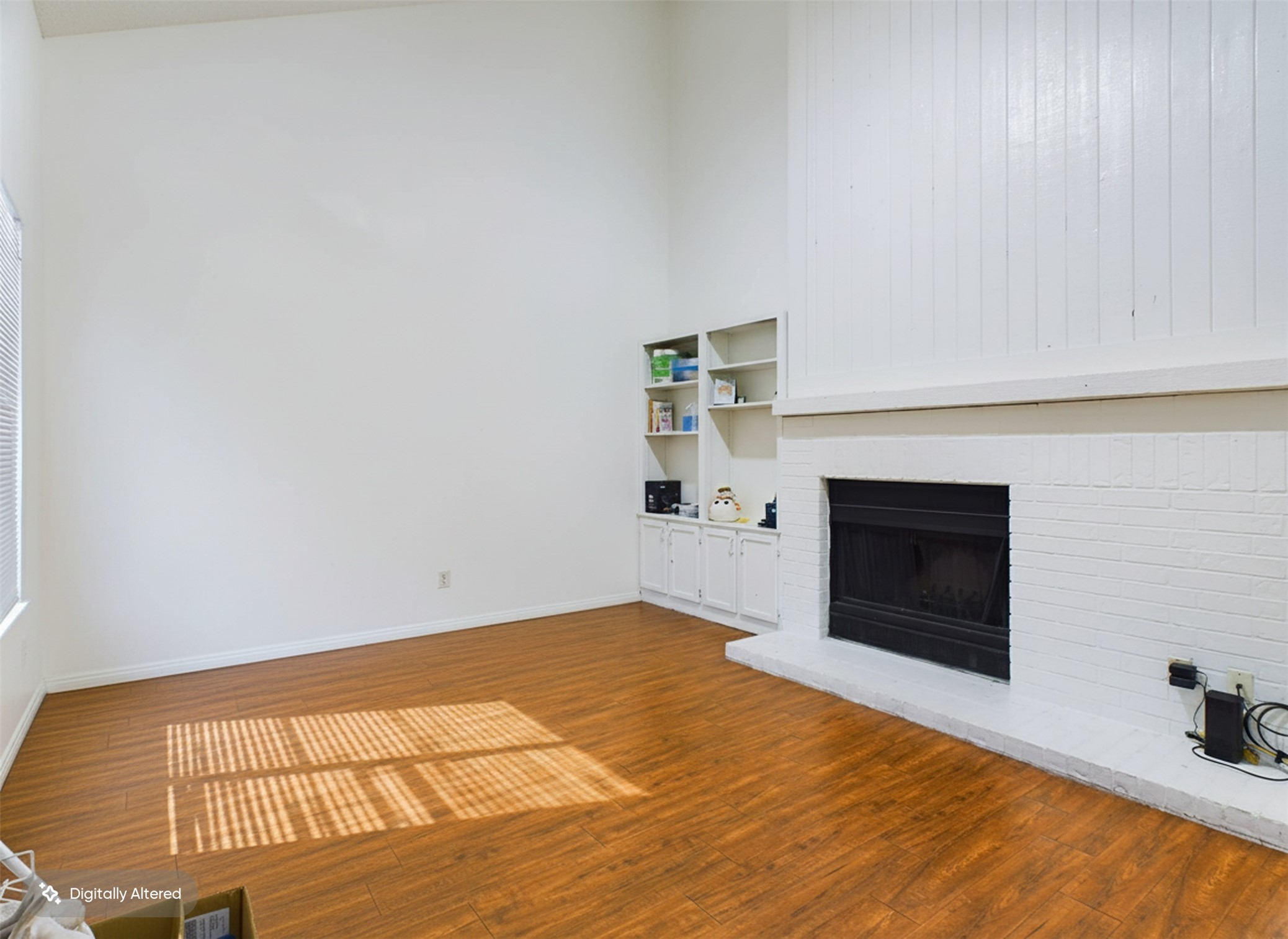 908 Poplar Street, Unit 201 Austin, TX 78705 - Photo 6 of 18 a view of empty room with wooden floor and fireplace