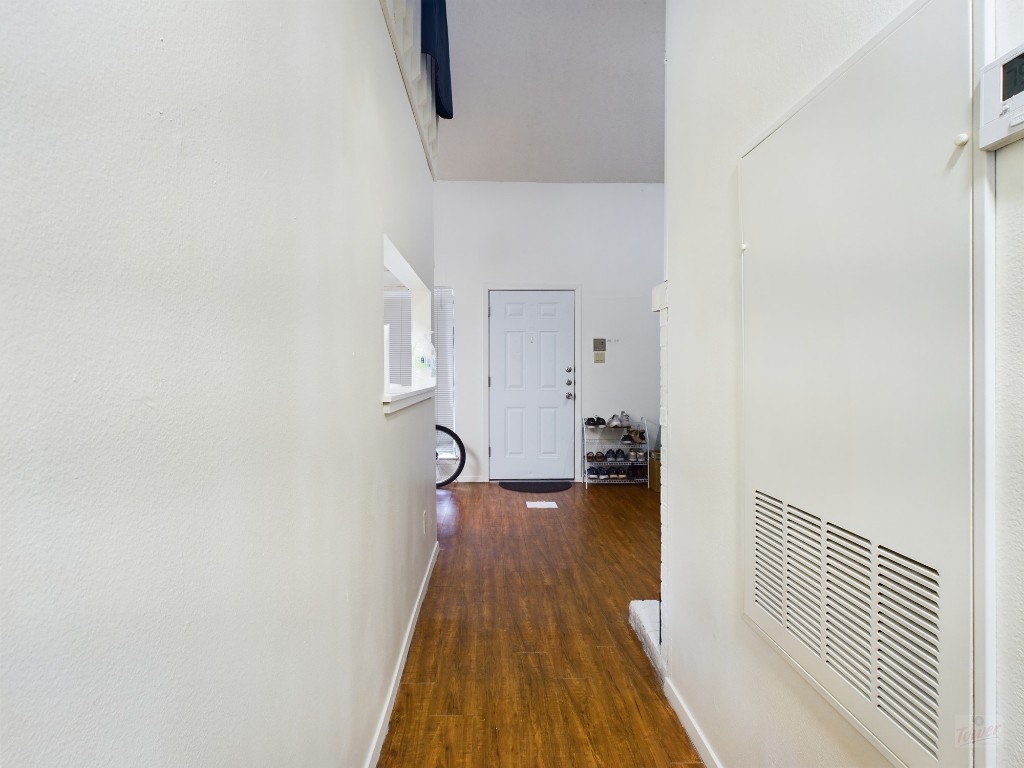 908 Poplar Street, Unit 201 Austin, TX 78705 - Photo 9 of 14 a view of a room with wooden floor