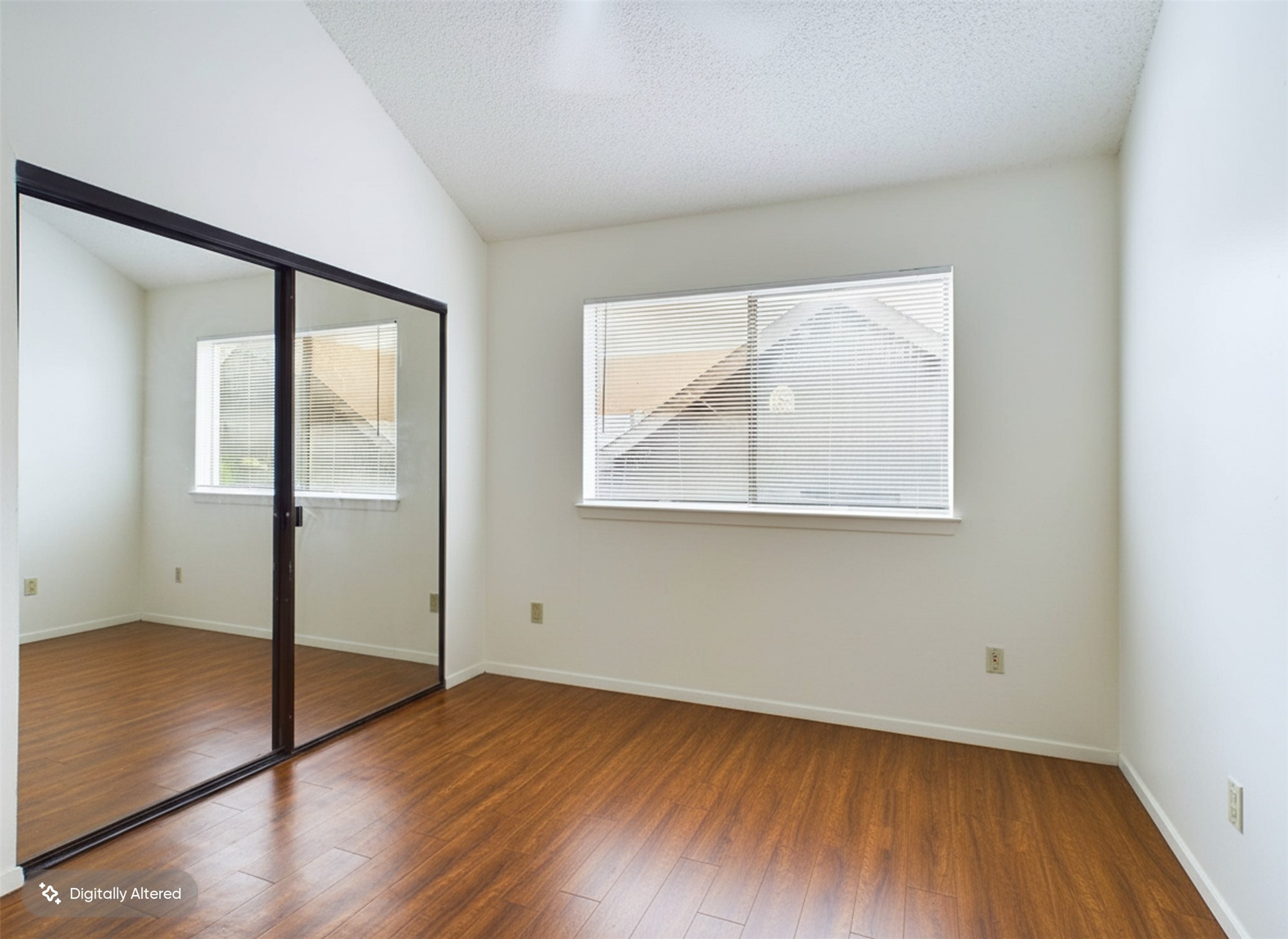908 Poplar Street, Unit 201 Austin, TX 78705 - Photo 10 of 18 an empty room with wooden floor and windows