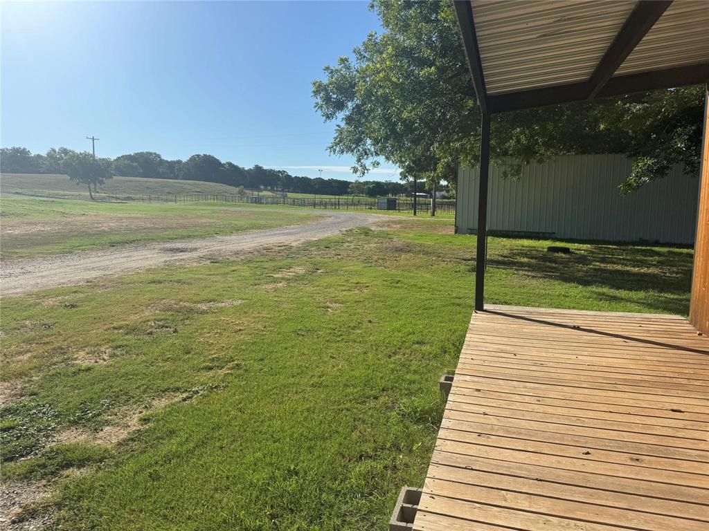 377 Private Road 3249, Unit ARENA Decatur, TX 76234 - Photo 25 of 40 a view of a lake with a yard