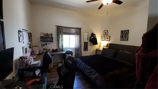 a view of a house with wooden roof and sitting area
