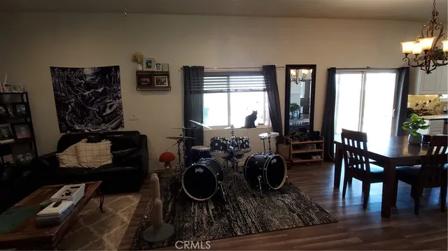 a living room with furniture and a ceiling fan