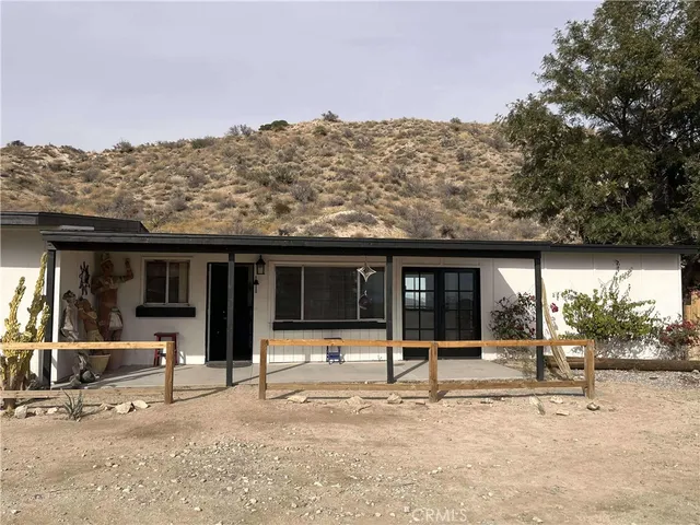 a kitchen with a stove and a refrigerator