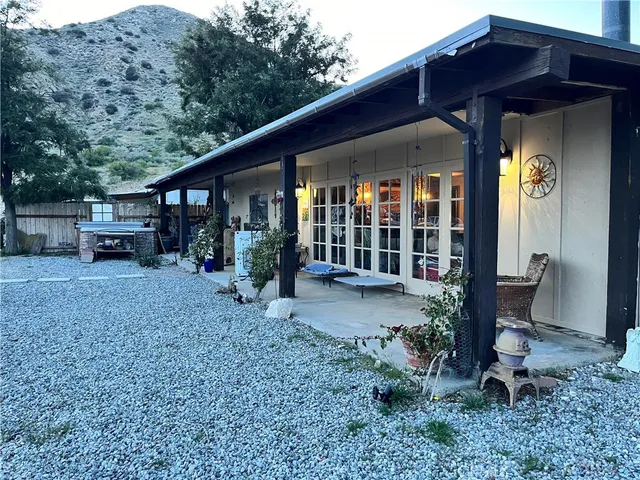 a view of a yard with a tree