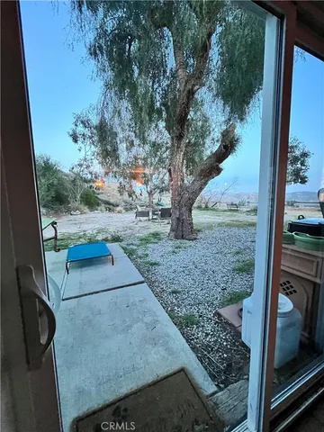 a living room with a rug and a flat screen tv