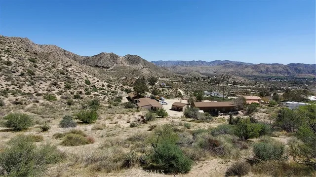 a view of a lake with a house in the background