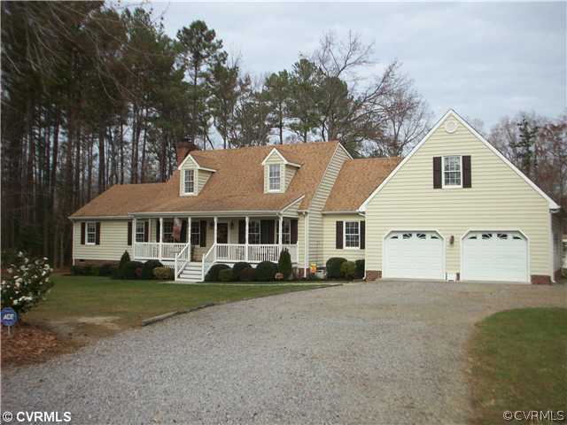 8244 White Oak Road Ford, VA 23850 - Photo 1 of 24 a view of a white house with a big yard and large trees