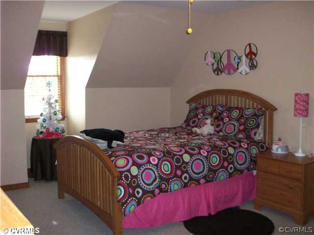 8244 White Oak Road Ford, VA 23850 - Photo 13 of 24 a bedroom with a bed and a window