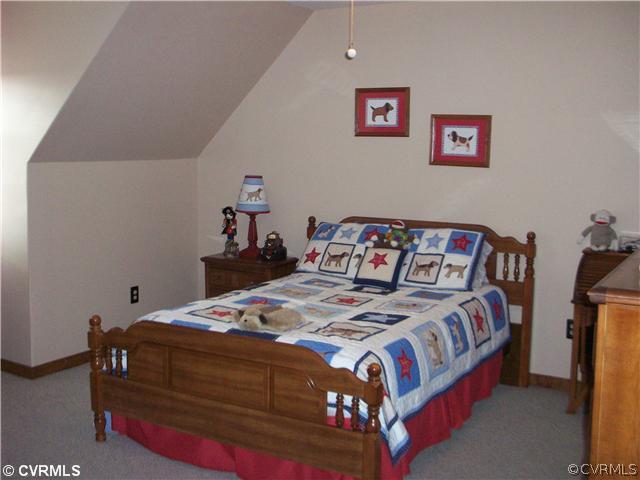 8244 White Oak Road Ford, VA 23850 - Photo 15 of 24 a bedroom with a bed and a dresser
