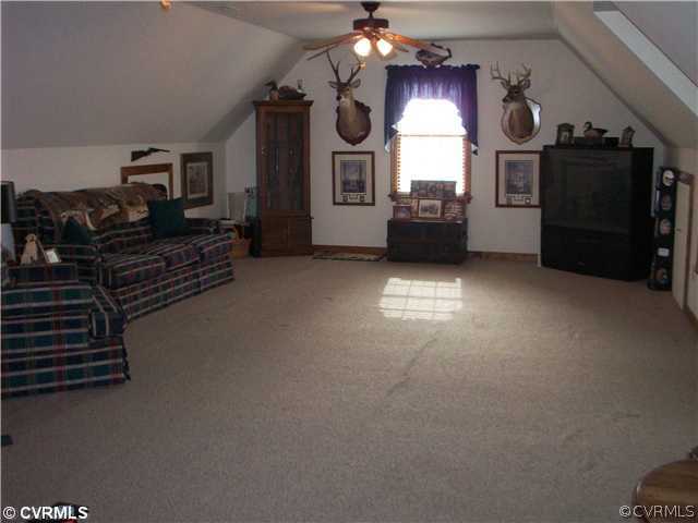 8244 White Oak Road Ford, VA 23850 - Photo 16 of 24 a view of a livingroom with furniture flat screen tv and windows
