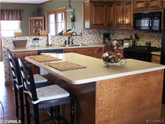 8244 White Oak Road Ford, VA 23850 - Photo 3 of 24 a kitchen with a table and chairs