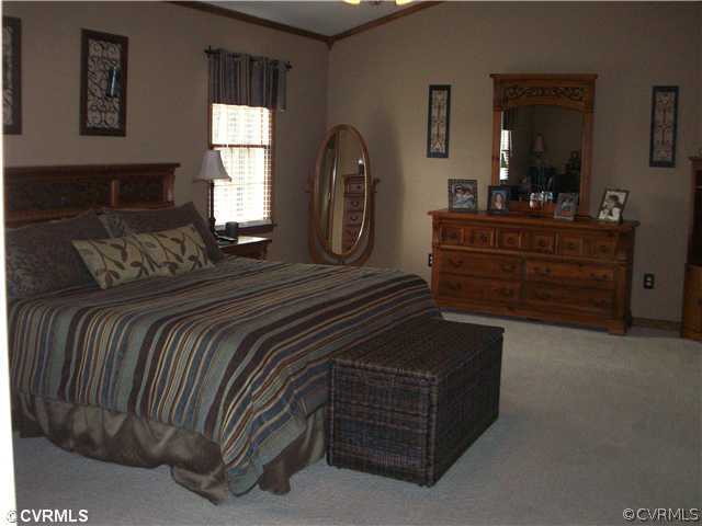 8244 White Oak Road Ford, VA 23850 - Photo 8 of 24 a bedroom with a bed and a dresser