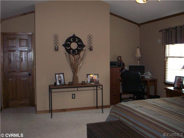 8244 White Oak Road Ford, VA 23850 - Photo 9 of 24 a bedroom with a bed and a dresser