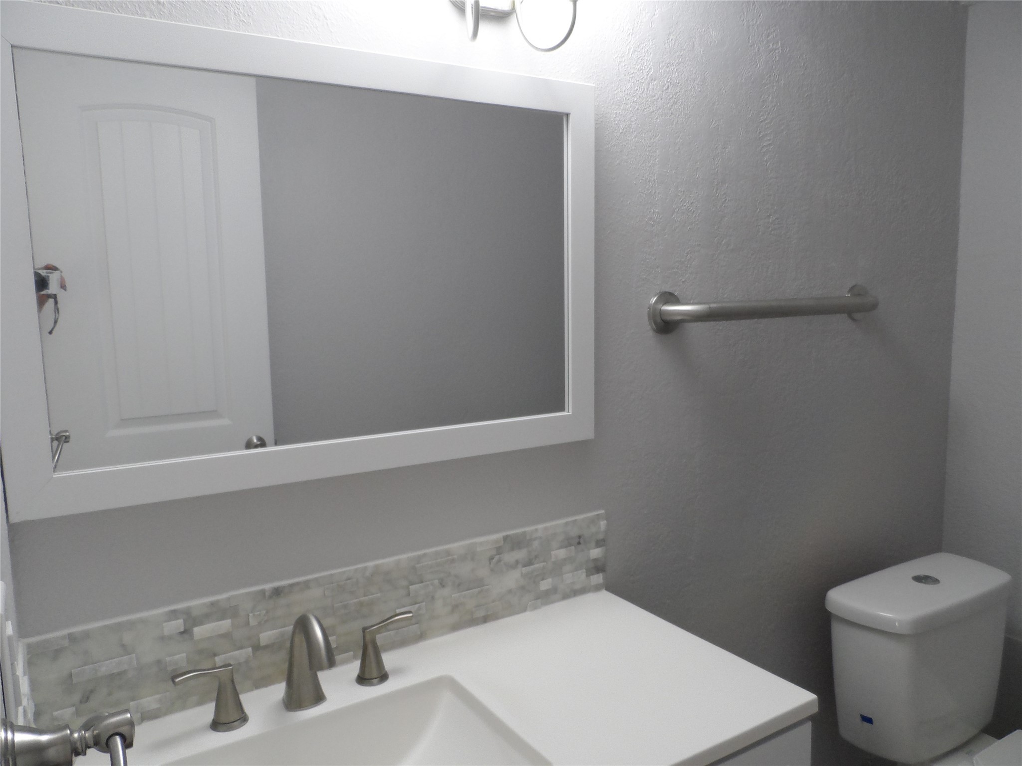 12900 Walden Road, Unit 618F Montgomery, TX 77356 - Photo 12 of 12 Updated bathroom featuring a modern vanity, sleek fixtures, and contemporary finishes.