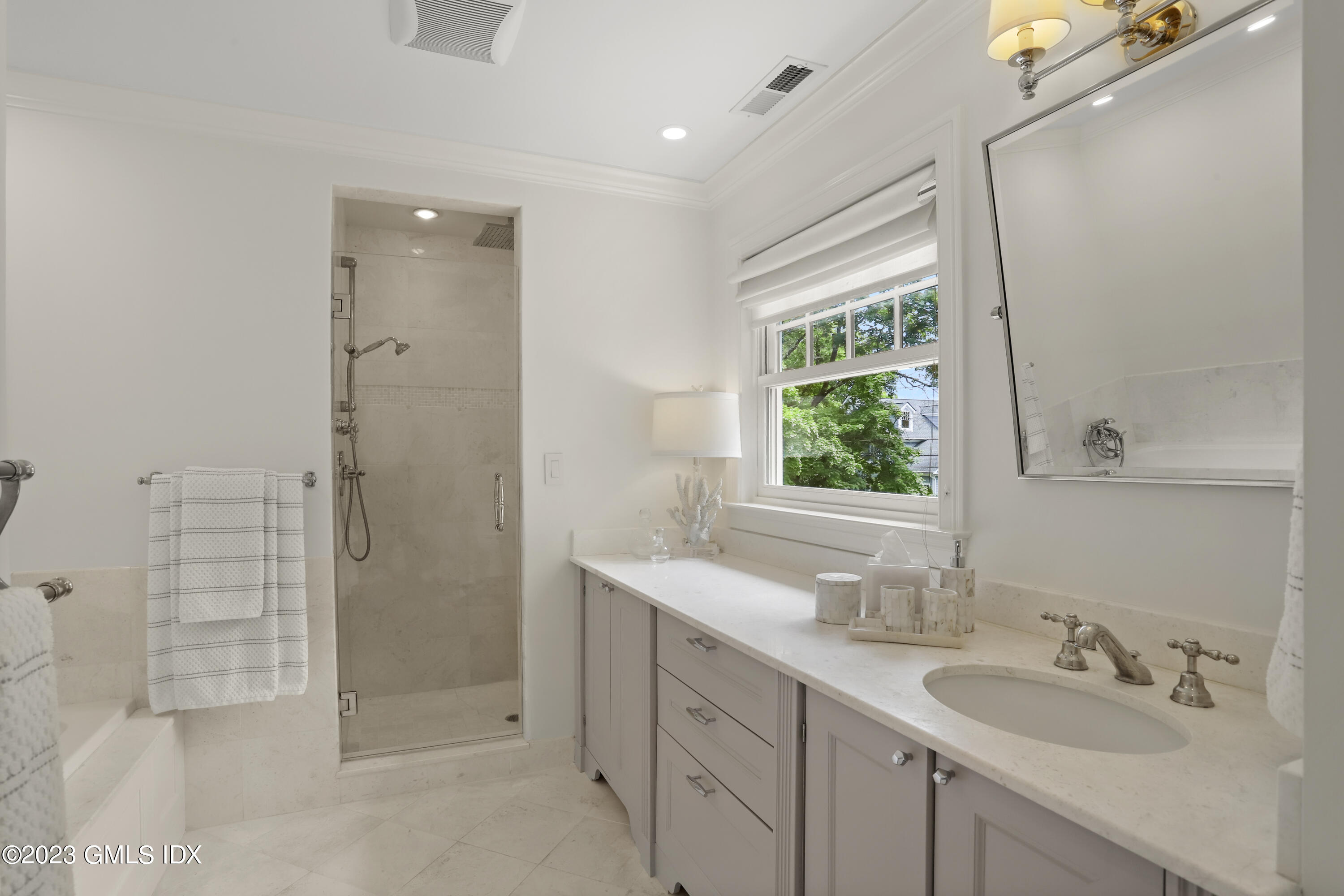 85 Mallard Drive Greenwich, CT 06830 - Photo 26 of 40 a bathroom with a double vanity sink mirror and shower