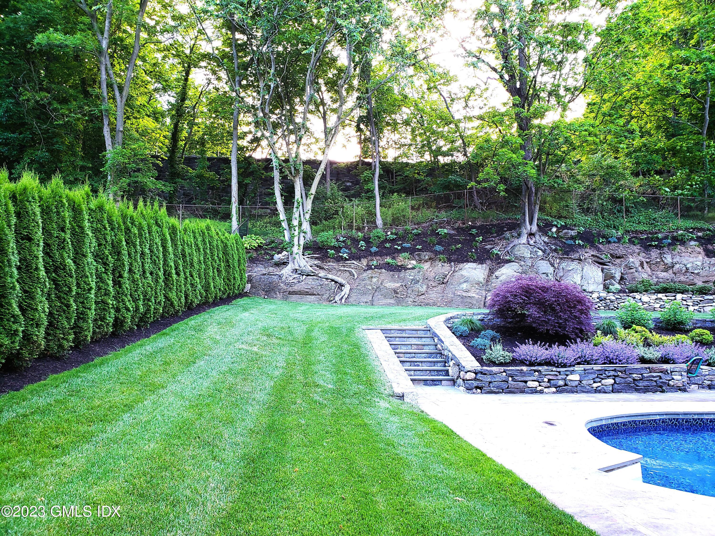 85 Mallard Drive Greenwich, CT 06830 - Photo 36 of 40 a view of a garden with a slide