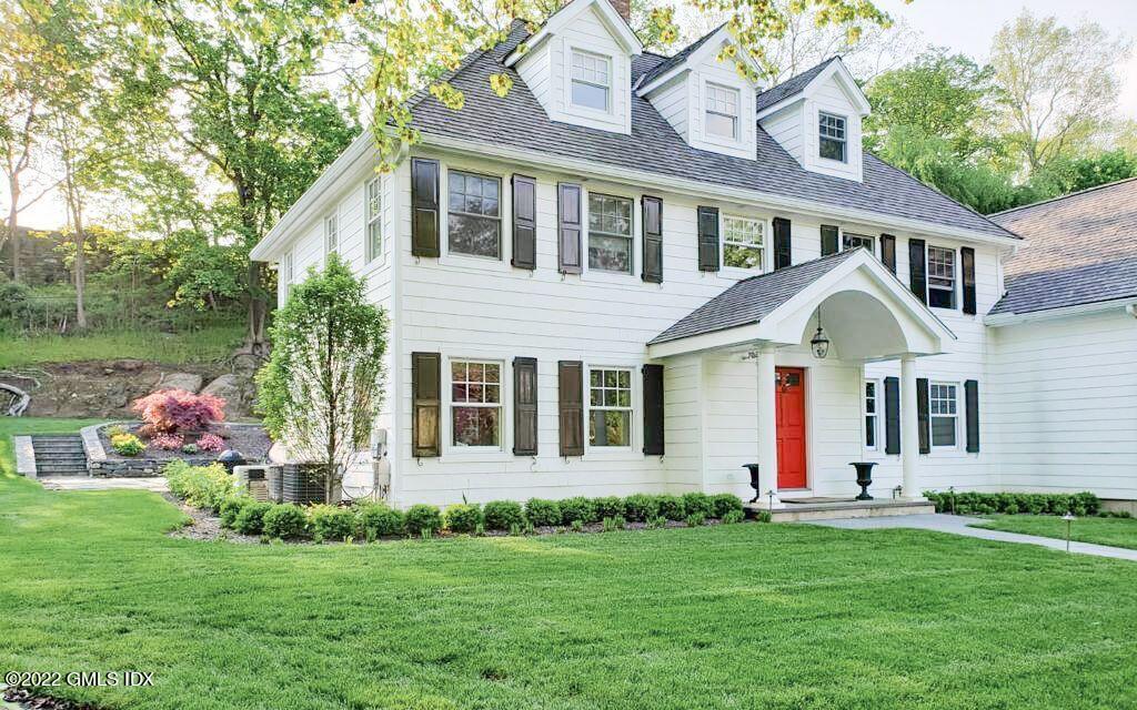 85 Mallard Drive Greenwich, CT 06830 - Photo 4 of 40 a front view of a house with a garden and plants