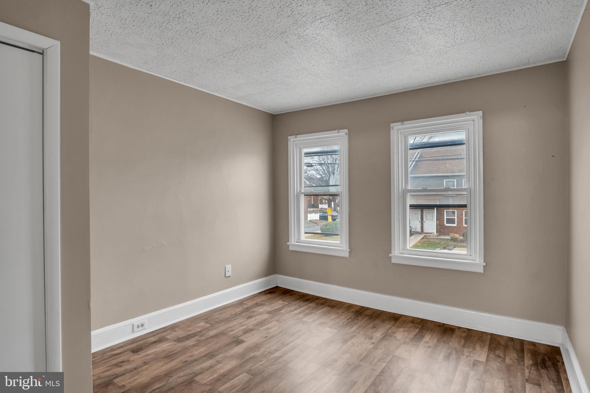 27 South Spring Garden Street Carlisle, PA 17013 - Photo 12 of 26 a view of an empty room with wooden floor and window
