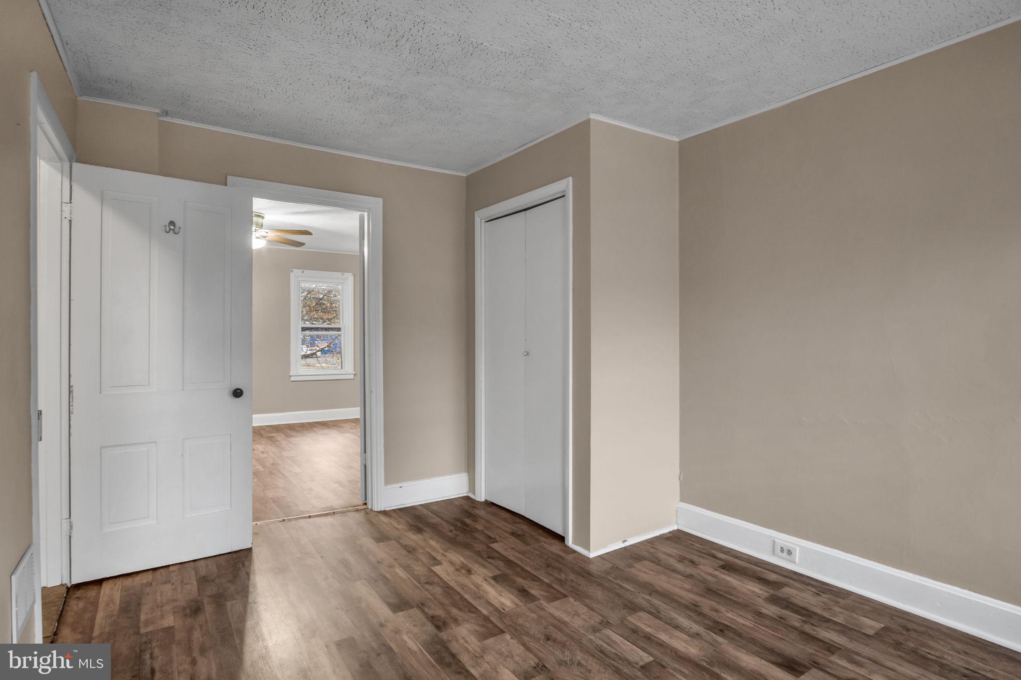 27 South Spring Garden Street Carlisle, PA 17013 - Photo 14 of 26 an empty room with wooden floor & windows