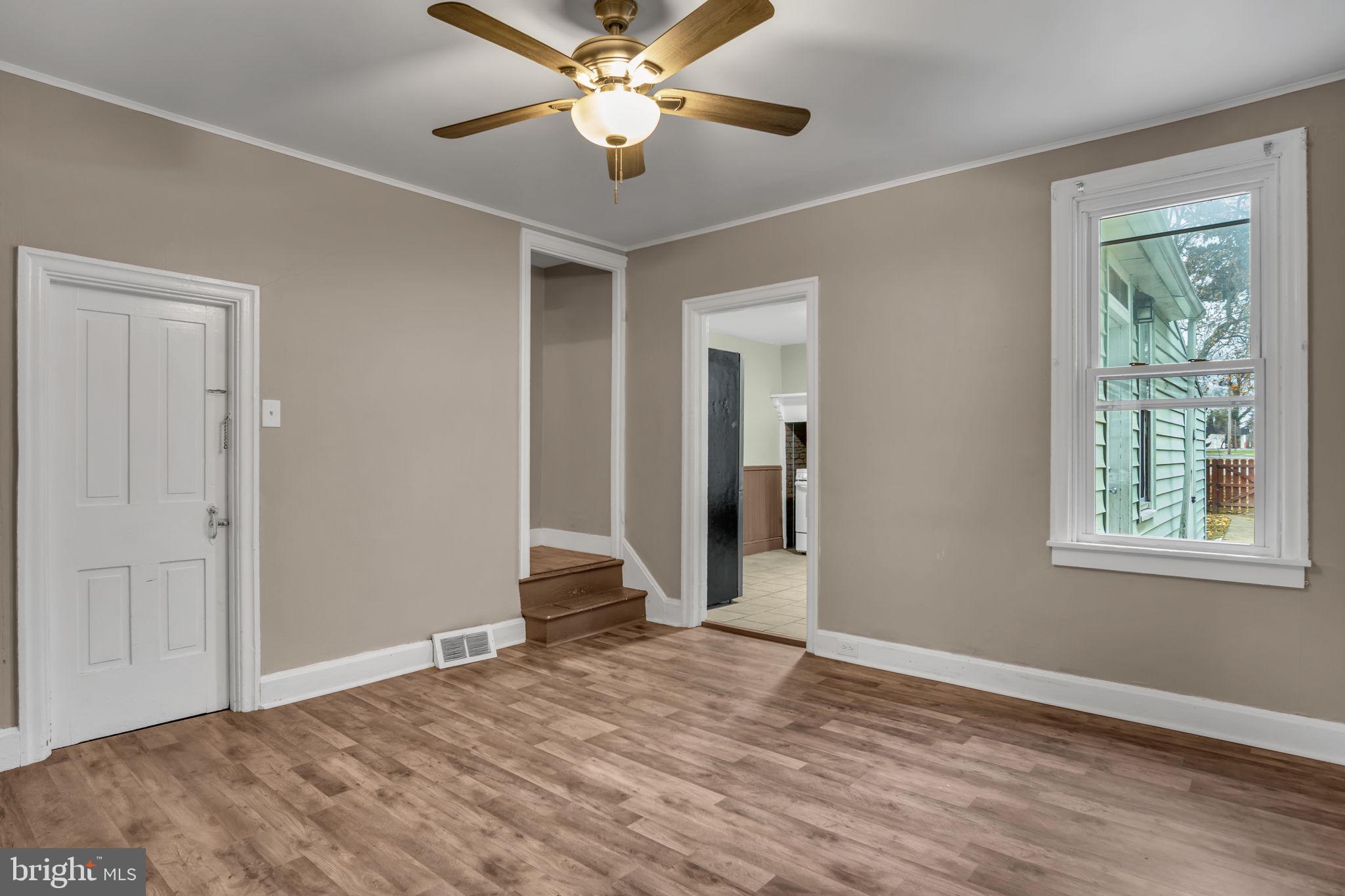 27 South Spring Garden Street Carlisle, PA 17013 - Photo 5 of 26 a view of empty room with wooden floor and fan