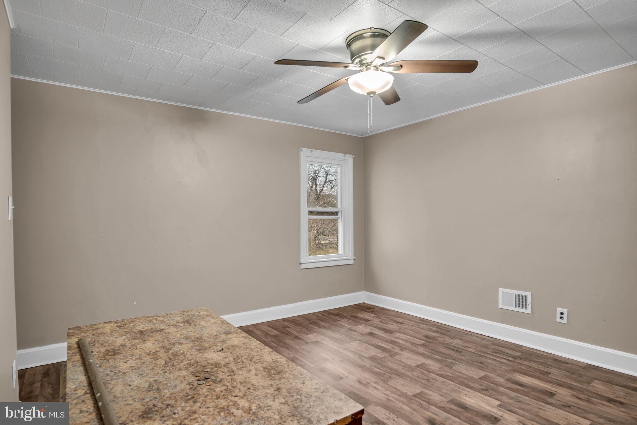 27 South Spring Garden Street Carlisle, PA 17013 - Photo 10 of 26 wooden floor in an empty room with a window