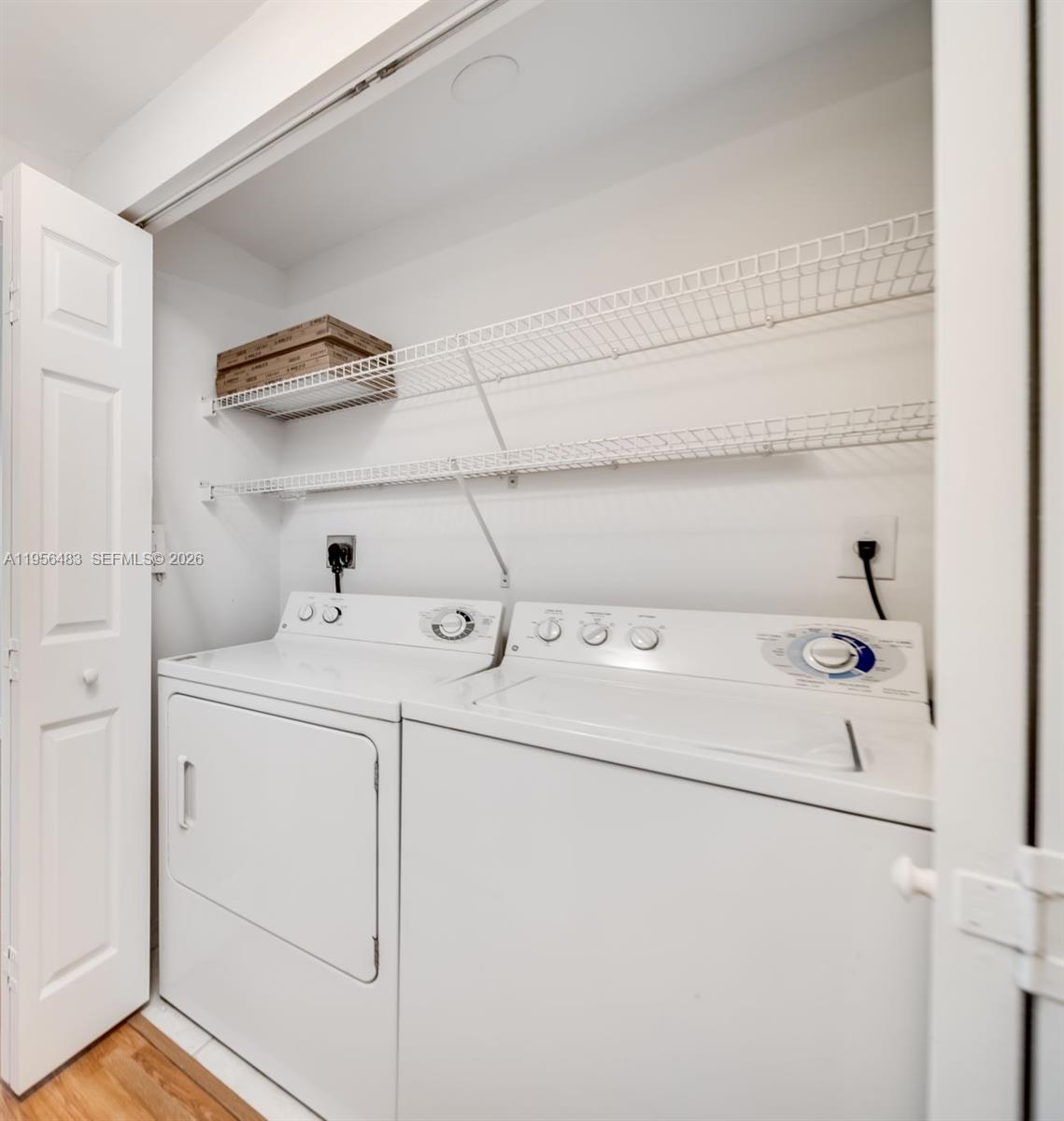 6831 Southwest 44th Street, Unit 304 Miami, FL 33155 - Photo 11 of 27 a utility room with dryer and washer