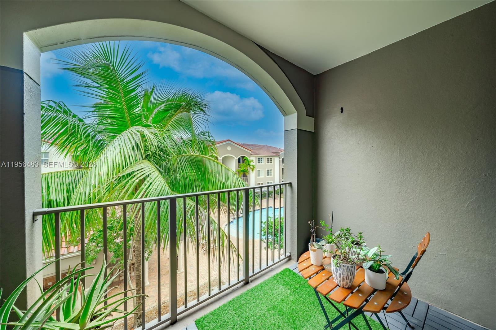 6831 Southwest 44th Street, Unit 304 Miami, FL 33155 - Photo 12 of 27 a view of a balcony with chairs