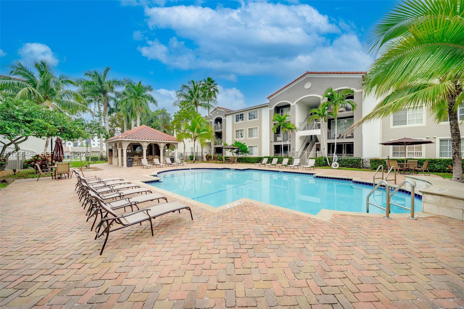 6831 Southwest 44th Street, Unit 304 Miami, FL 33155 - Photo 16 of 27 a view of house with swimming pool outdoor seating