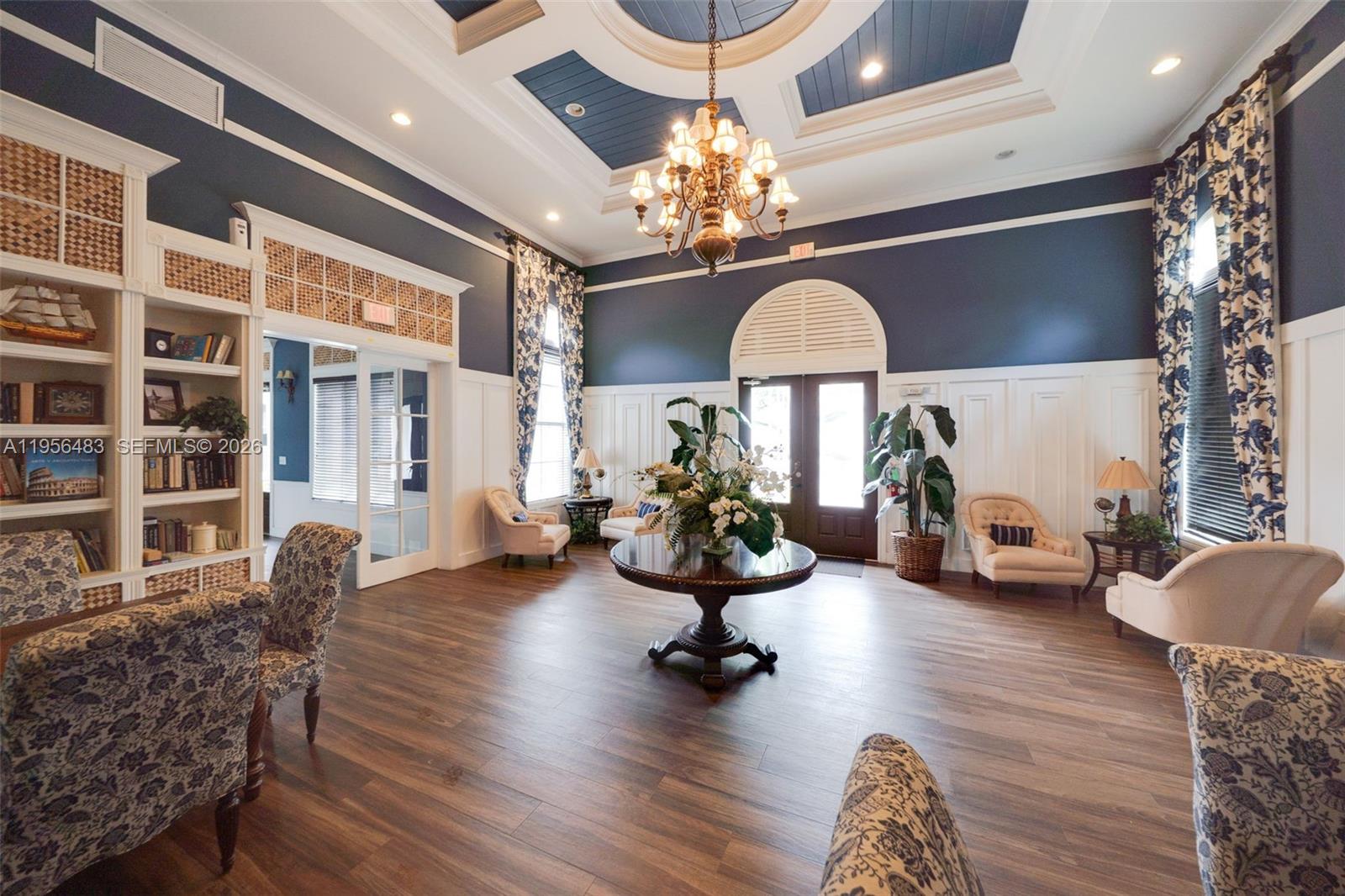 6831 Southwest 44th Street, Unit 304 Miami, FL 33155 - Photo 24 of 27 a living room with furniture chandelier and a chandelier