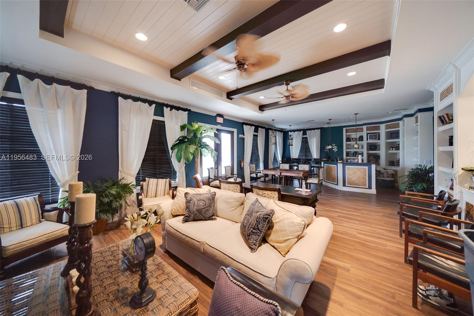 6831 Southwest 44th Street, Unit 304 Miami, FL 33155 - Photo 26 of 27 a living room with furniture and a large window