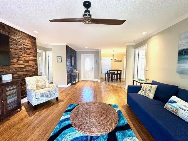 a living room with furniture fireplace and a window