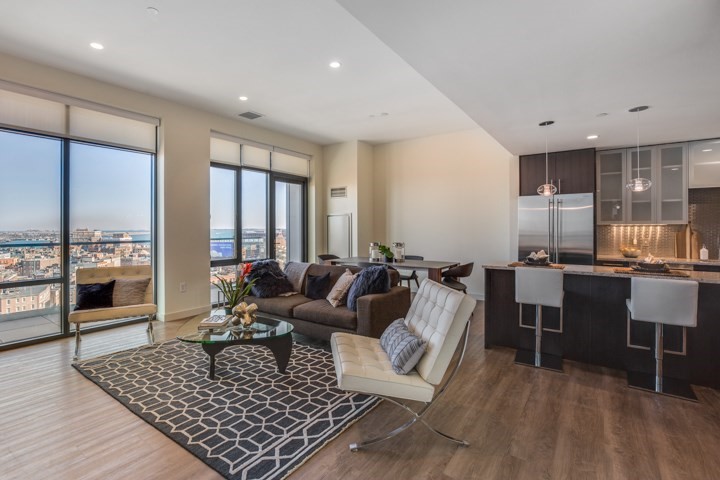 1 Canal Street, Unit PH1203 Boston, MA 02114 - Photo 3 of 17 a living room with furniture rug and wooden floor