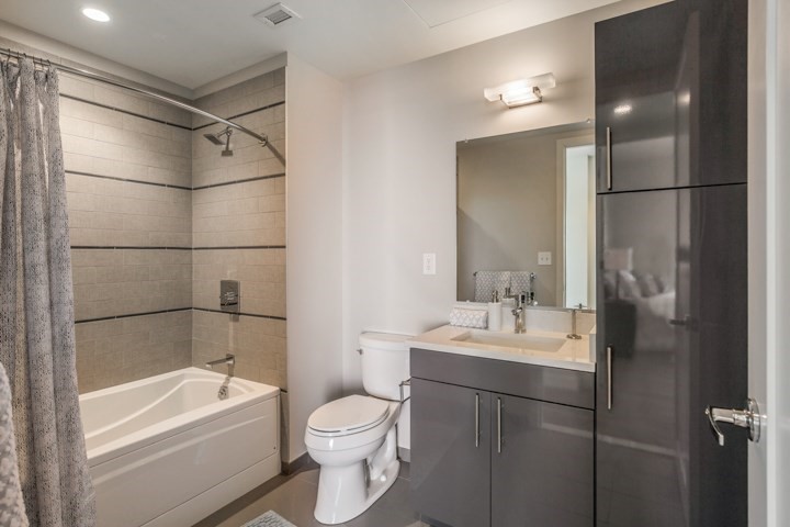 1 Canal Street, Unit PH1203 Boston, MA 02114 - Photo 7 of 17 a bathroom with a sink toilet and shower