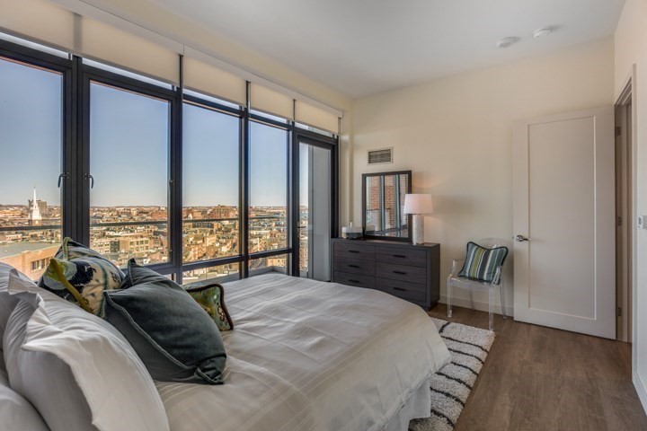 1 Canal Street, Unit PH1203 Boston, MA 02114 - Photo 9 of 17 a bedroom with furniture and a large window