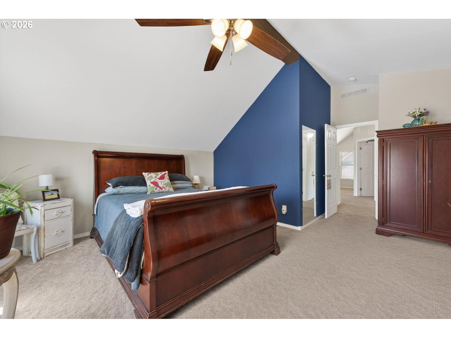 538 North Tam Rim Drive Sisters, OR 97759 - Photo 32 of 45 a bedroom with a bed and a chandelier