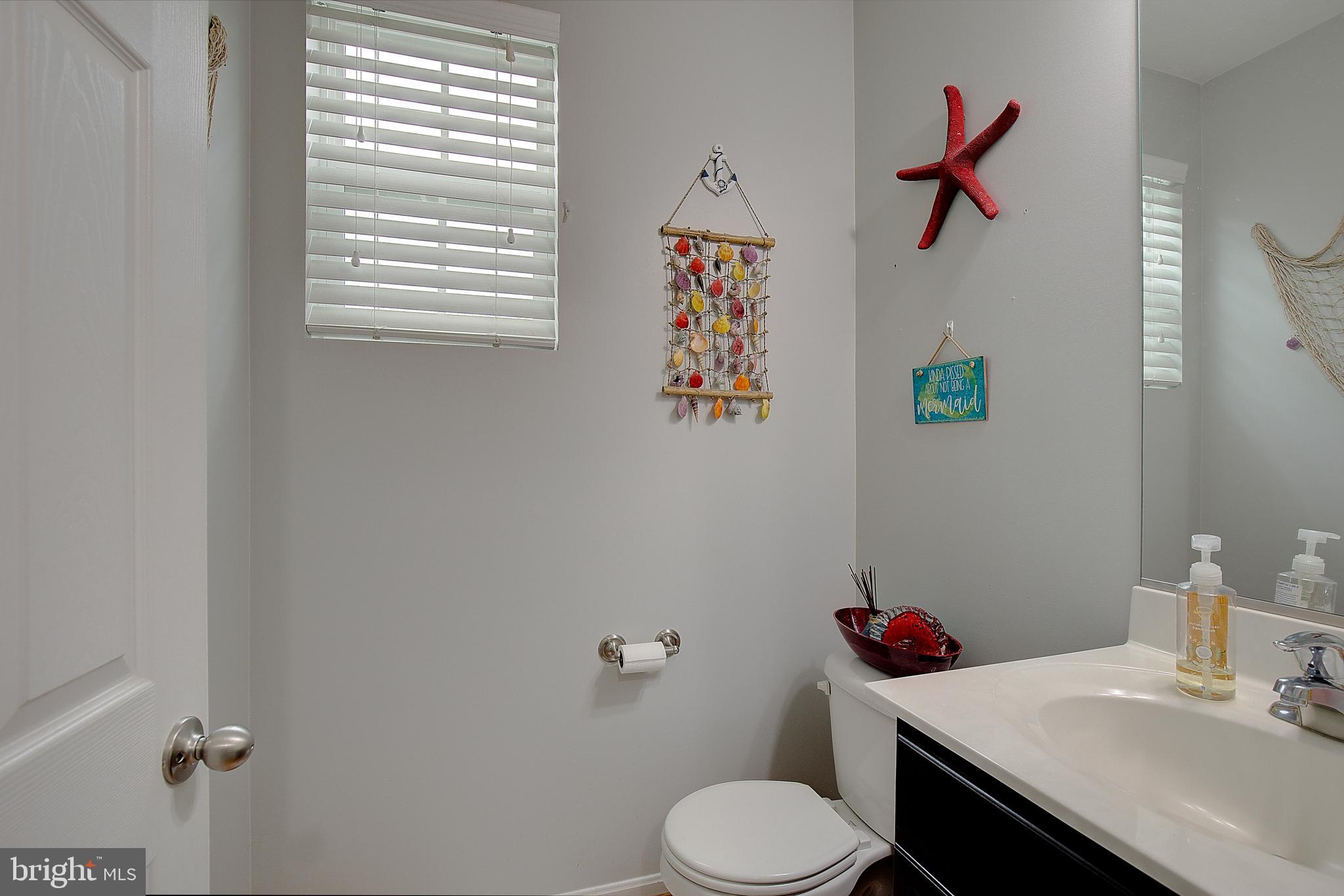 403 Venton Road Edgewater, MD 21037 - Photo 23 of 62 a bathroom with a sink vanity mirror and toilet