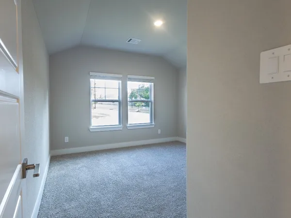 an empty room with closet area