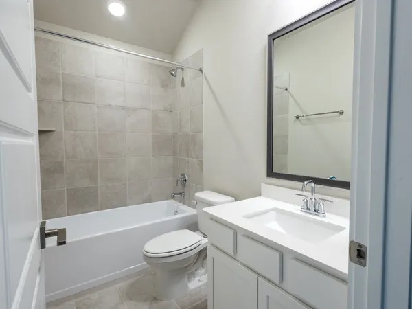 a view of a livingroom with a ceiling fan and window