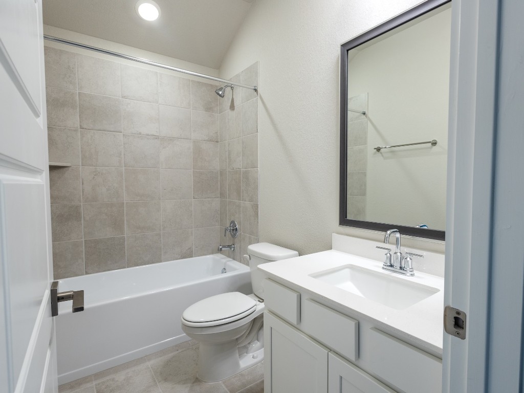 2010 Bluff Oak Street Conroe, TX 77304 - Photo 17 of 35 a bathroom with a sink a toilet and shower