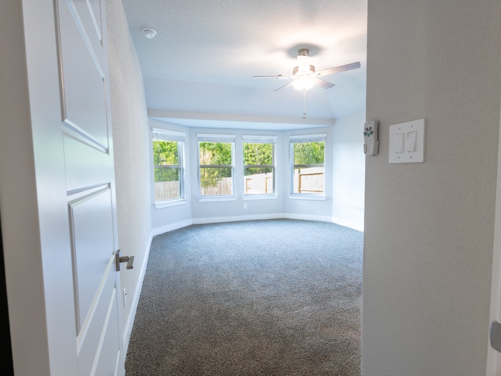 2010 Bluff Oak Street Conroe, TX 77304 - Photo 18 of 35 a view of a livingroom with a ceiling fan and window