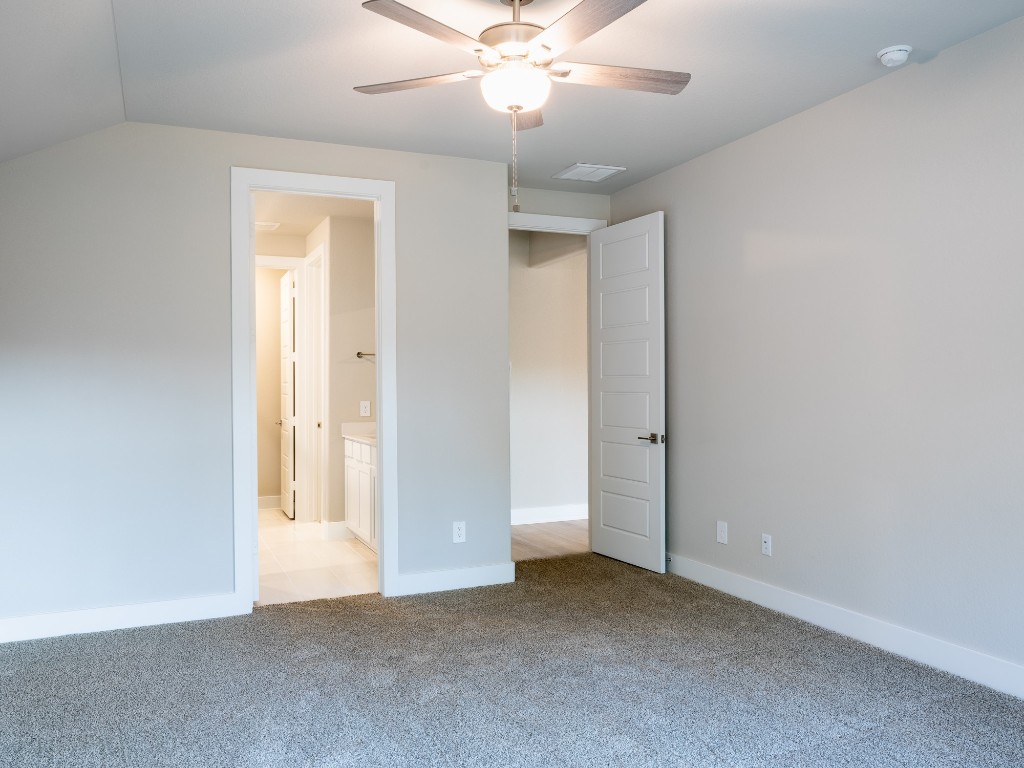 2010 Bluff Oak Street Conroe, TX 77304 - Photo 20 of 35 an empty room with closet and a chandelier fan