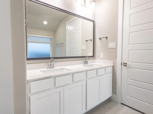 a bathroom with a shower a toilet and a sink