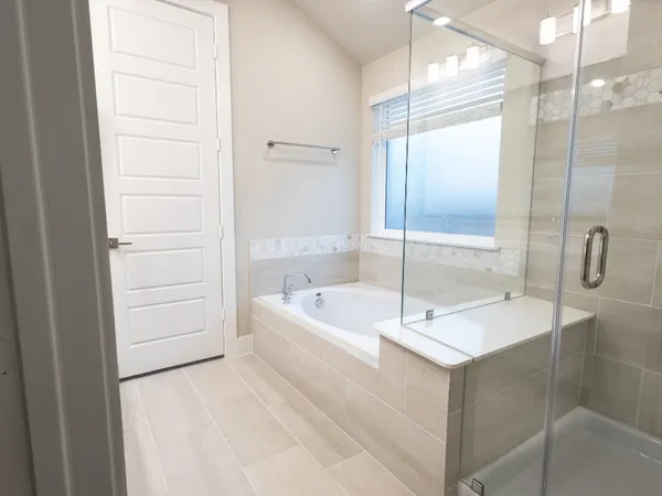 a bathroom with a shower and a bathtub