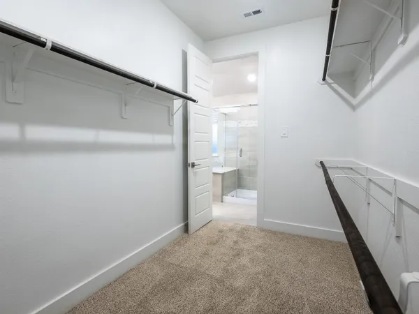 a view of an empty walk in closet