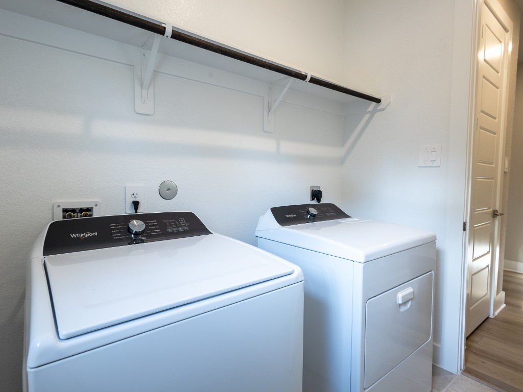 2010 Bluff Oak Street Conroe, TX 77304 - Photo 27 of 35 a utility room with dryer and washer